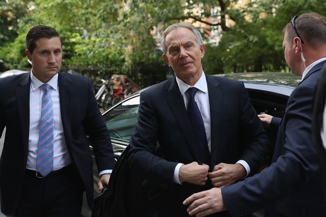 Tony Blair arrives back at his home after a press conference following the outcome of the Iraq Inquiry report