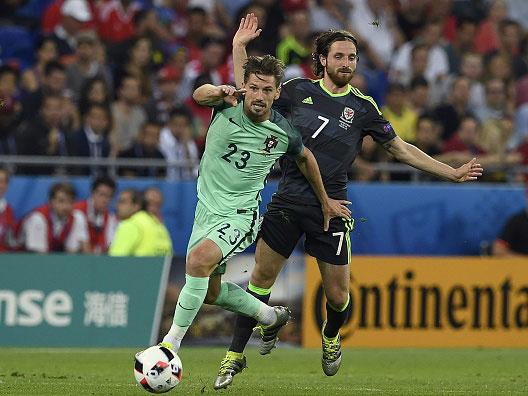 Adrien Silva takes on Joe Allen as Portugal overcame Wales to make the Euro 2016 final (Getty)