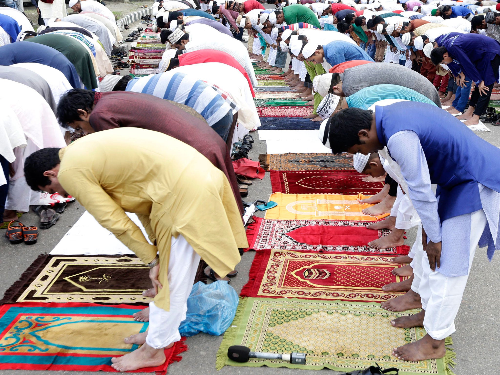 Muslims attend Eid al-Fitr prayers in front of the National Eid Prayer Ground at the High-Court in Dhaka, Bangladesh, 07 July