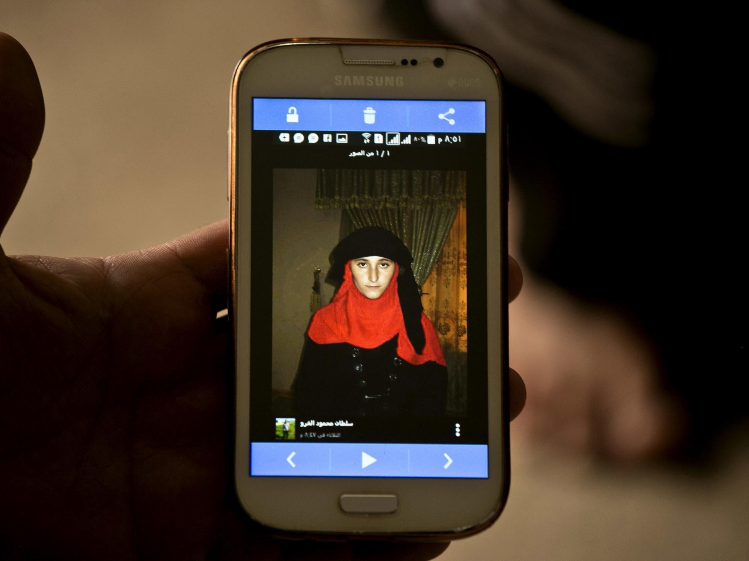 An enslaved Yazidi woman appears on a messenger service