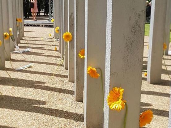 A minute's silence was observed in memory of those who lost their lives and a single flower was laid at each pillar of the 7 July memorial