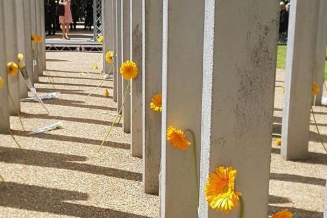 A minute's silence was observed in memory of those who lost their lives and a single flower was laid at each pillar of the 7 July memorial