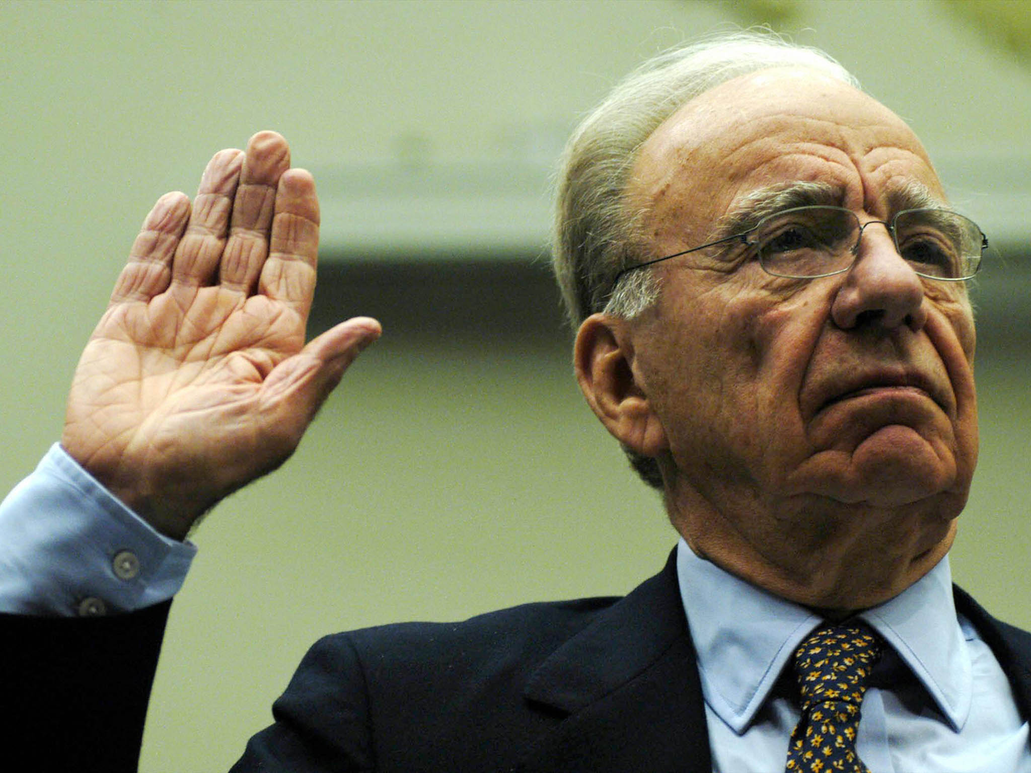 Rupert Murdoch, is sworn in before testimony to the House Committee on the Judiciary on Capitol Hill in Washington