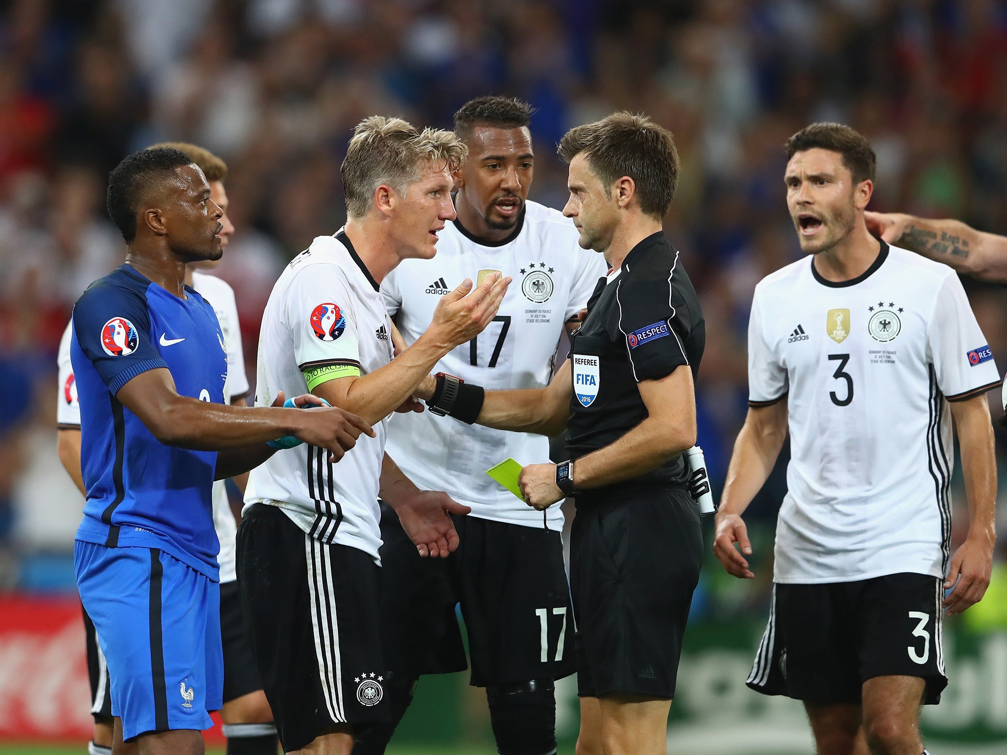 Schweinsteiger protests against referee Rizzoli's harsh penalty decision