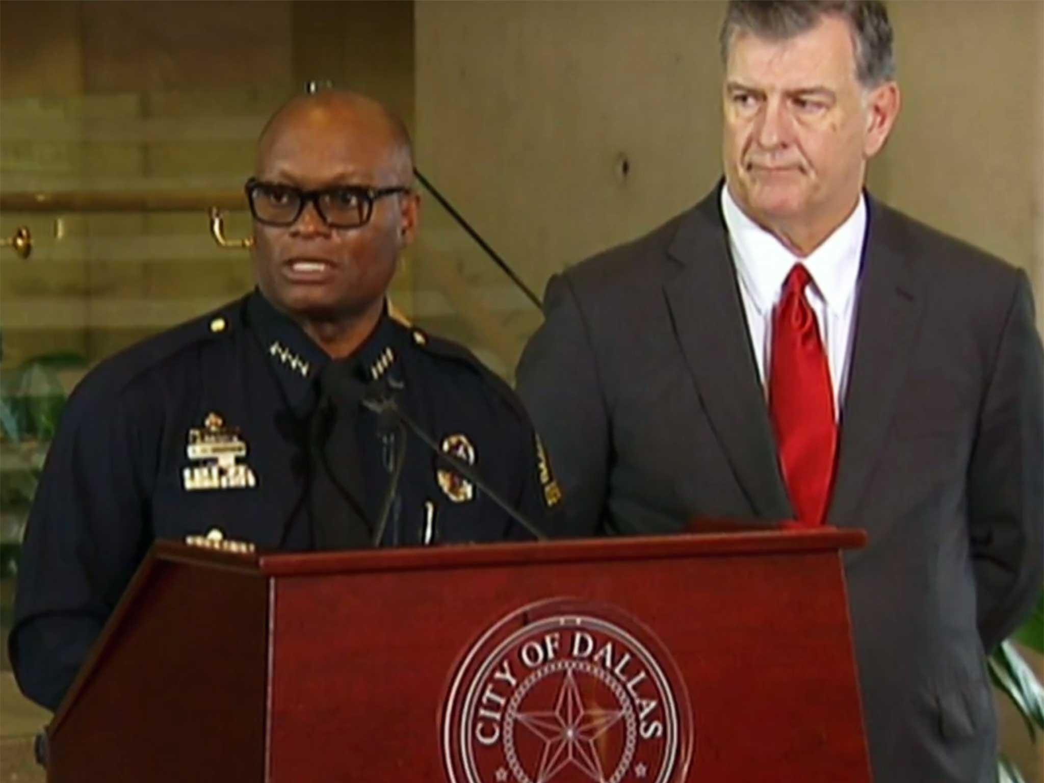 Dallas Police Chief David Brown and city mayor Mike Rawlings at a press conference this morning