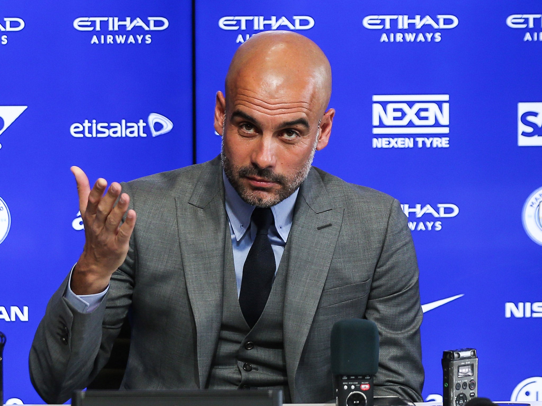 &#13;
Guardiola addresses the media during his inaugural press conference as City boss &#13;