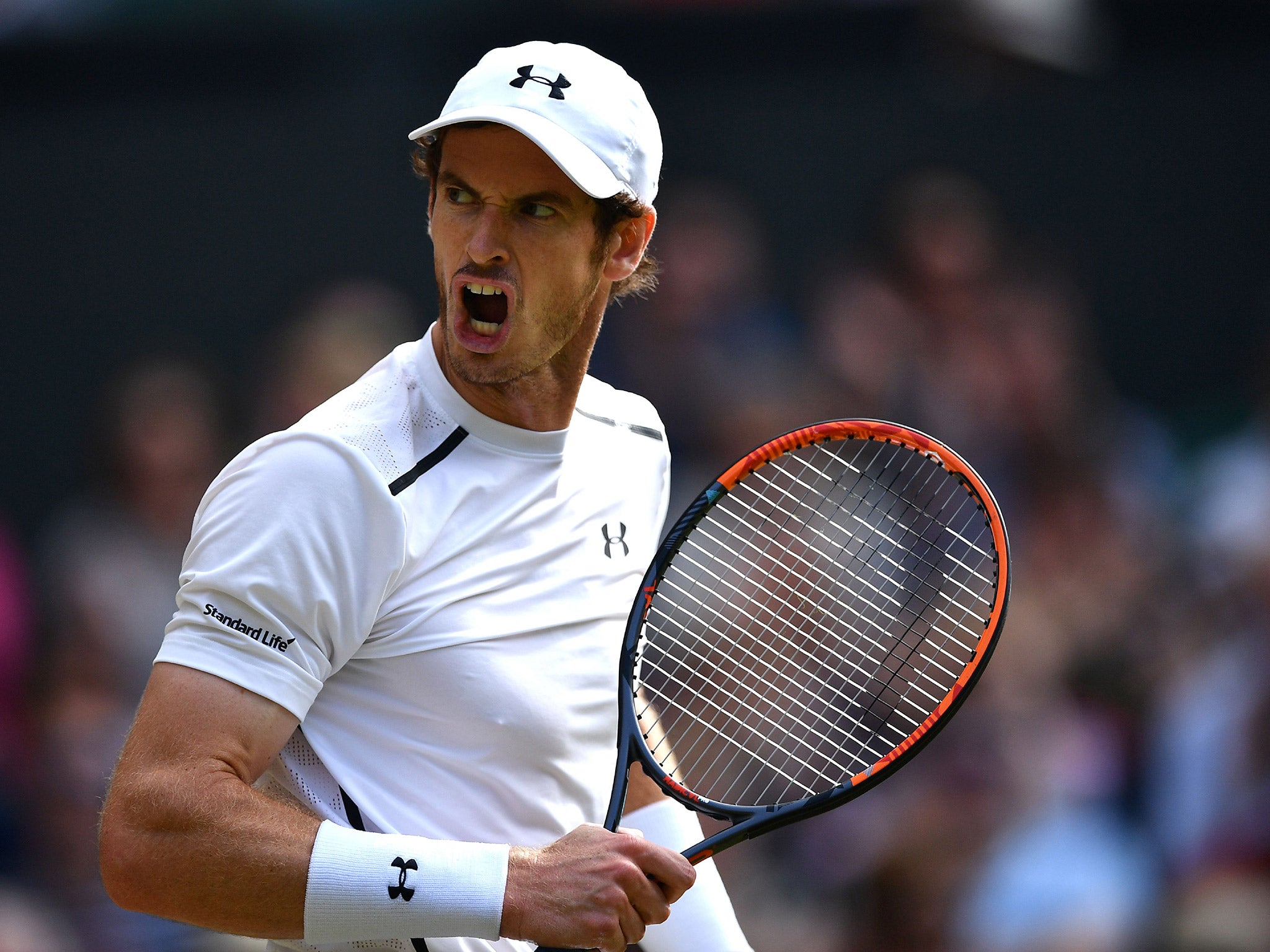 Andy Murray celebrates taking the first set against Tomas Berdych