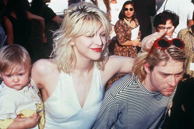 Courtney Love and Kurt Cobain with their daughter Frances Bean at the MTV awards in 1993