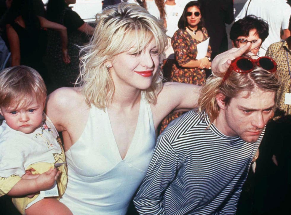 Courtney Love and Kurt Cobain with their daughter Frances Bean at the MTV awards in 1993