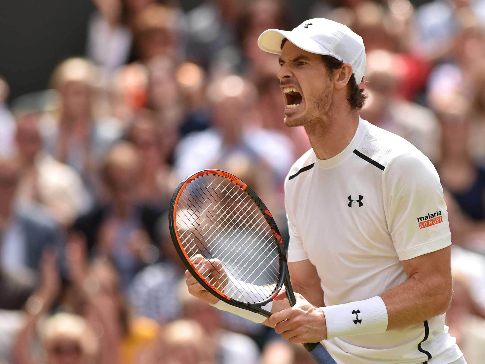 Andy Murray celebrates winning the first set in the Wimbledon men's final