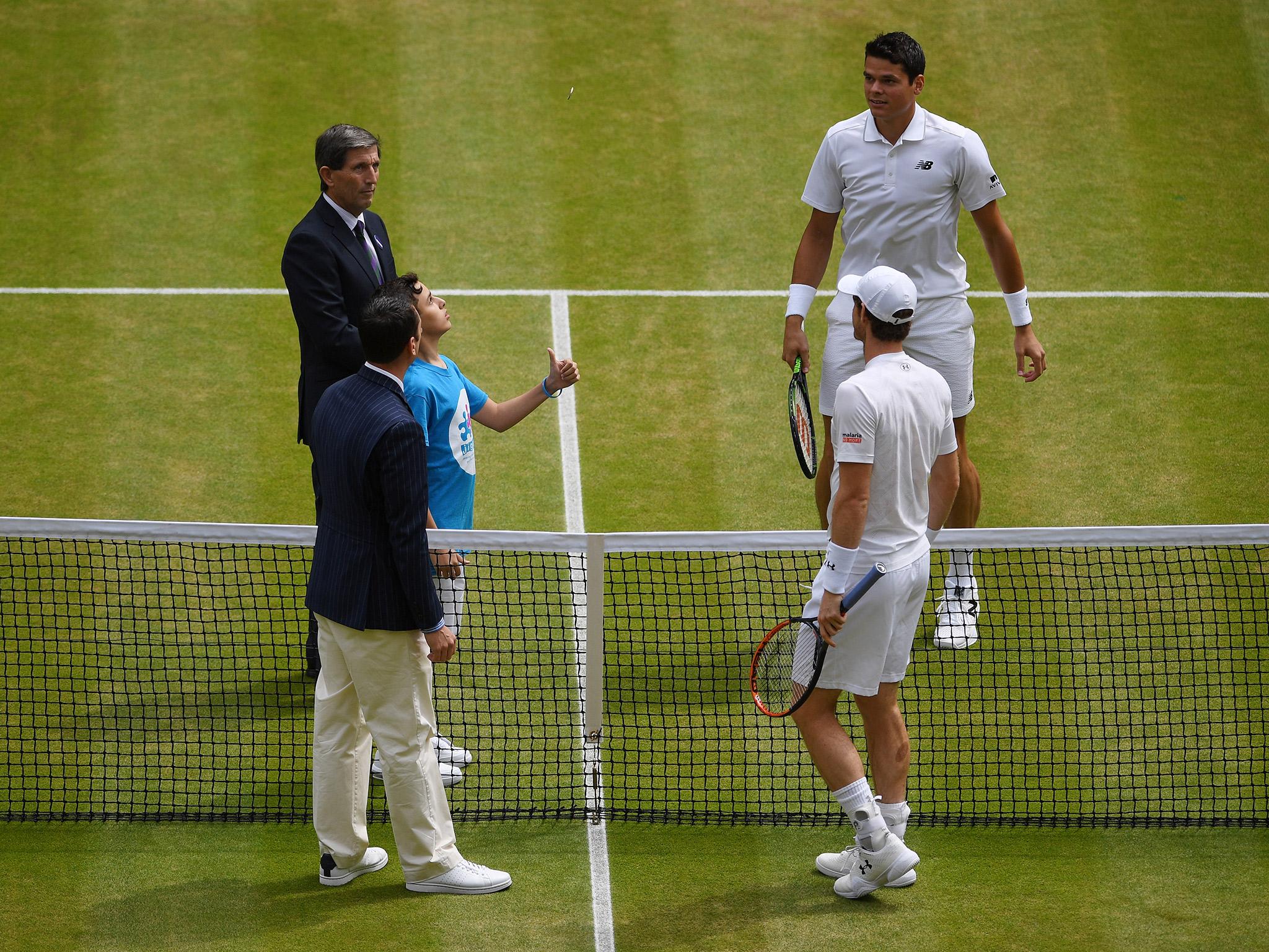 Murray and Raonic attend the coin toss before their Wimbledon final.