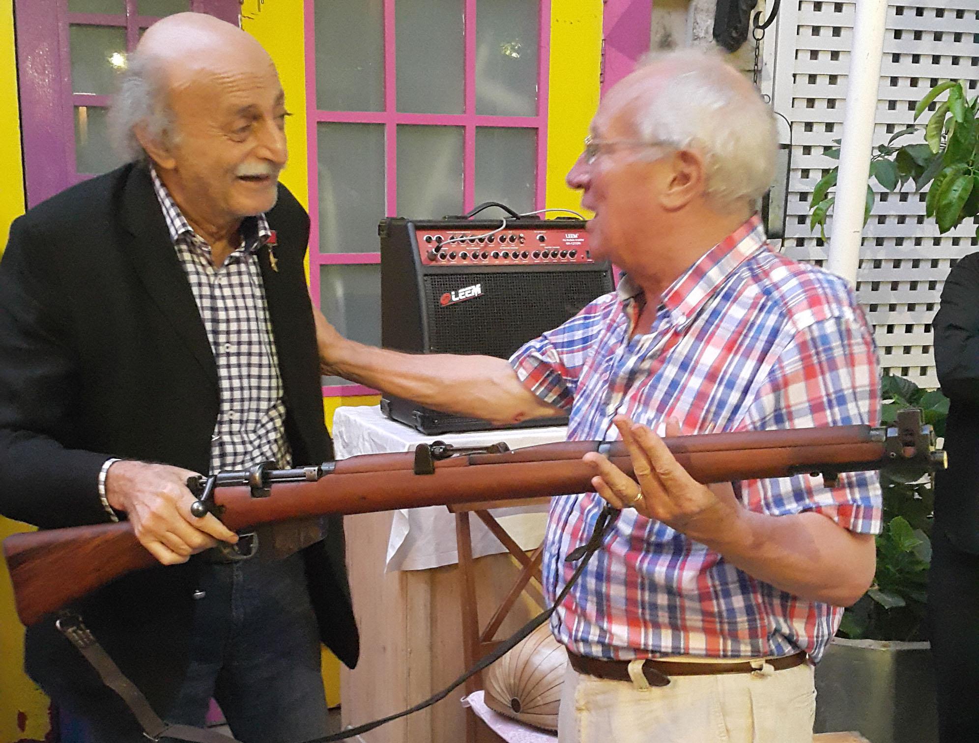Robert Fisk receives a First World War rifle from Walid Jumblatt for his birthday
