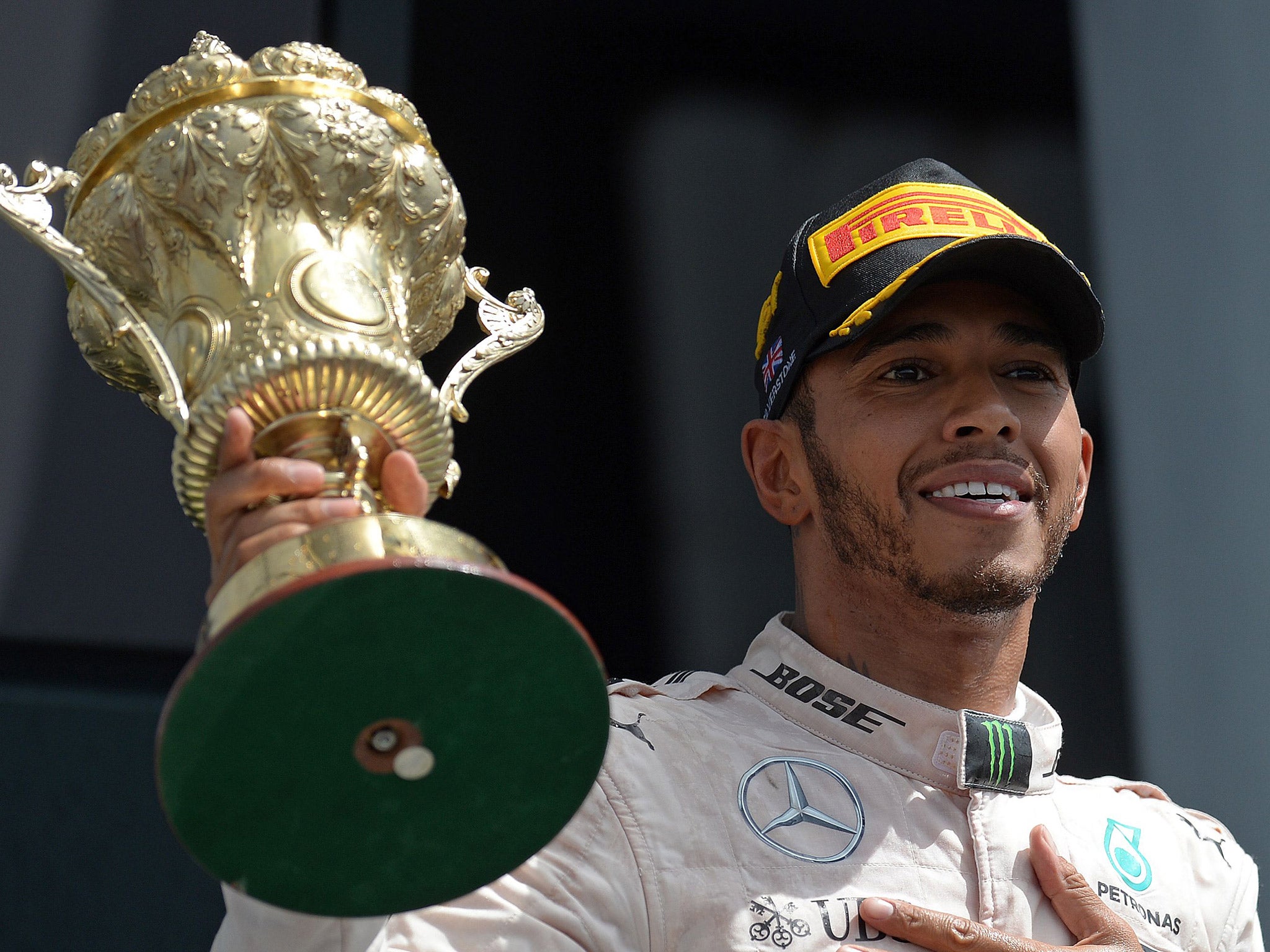 Lewis Hamilton lifts the trophy after winning the British Grand Prix