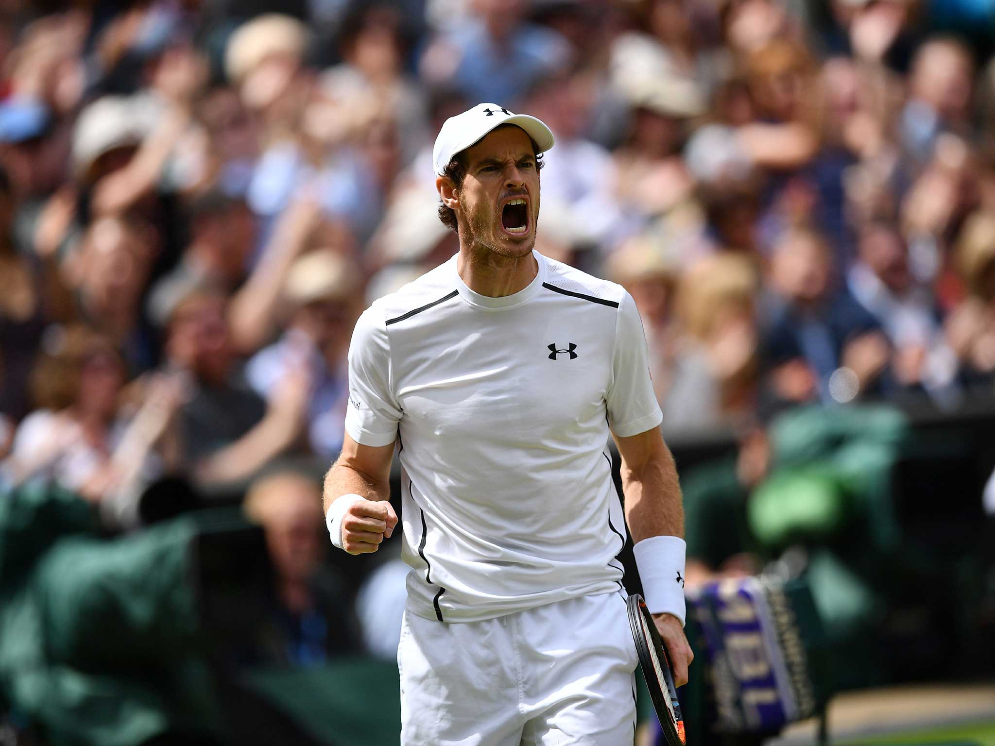 Andy Murray roars in delight upon winning his second Wimbledon title