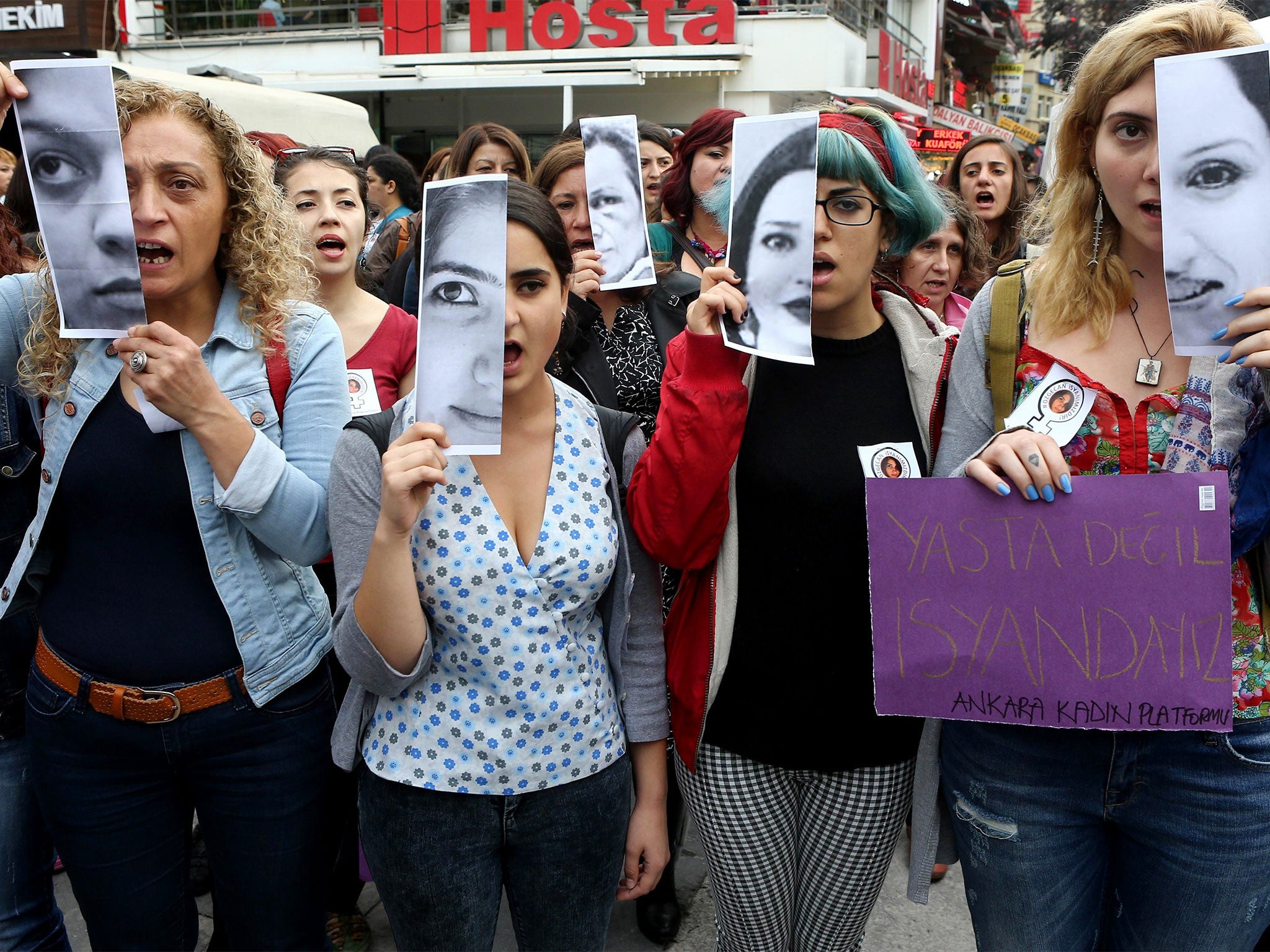 Turkish women display photographs of victims of violence during a 2011 demonstration. The pictures include those of Özgecan Aslan, a student who was killed while resisting an attempted rape.