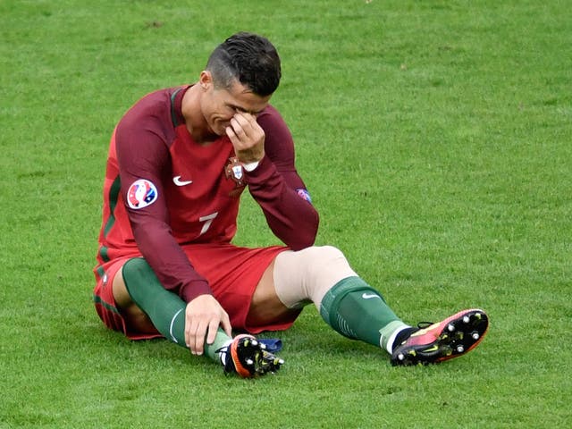 Cristiano Ronaldo cries after injury forces him off during the Euro 2016 final