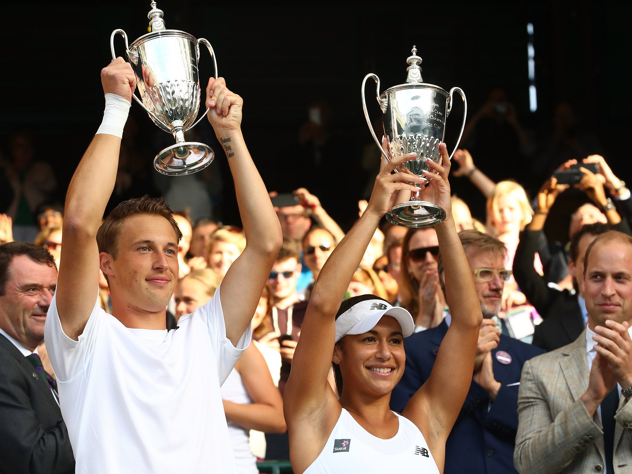 Kontinen and Watson lift their trophies after winning the mixed doubles