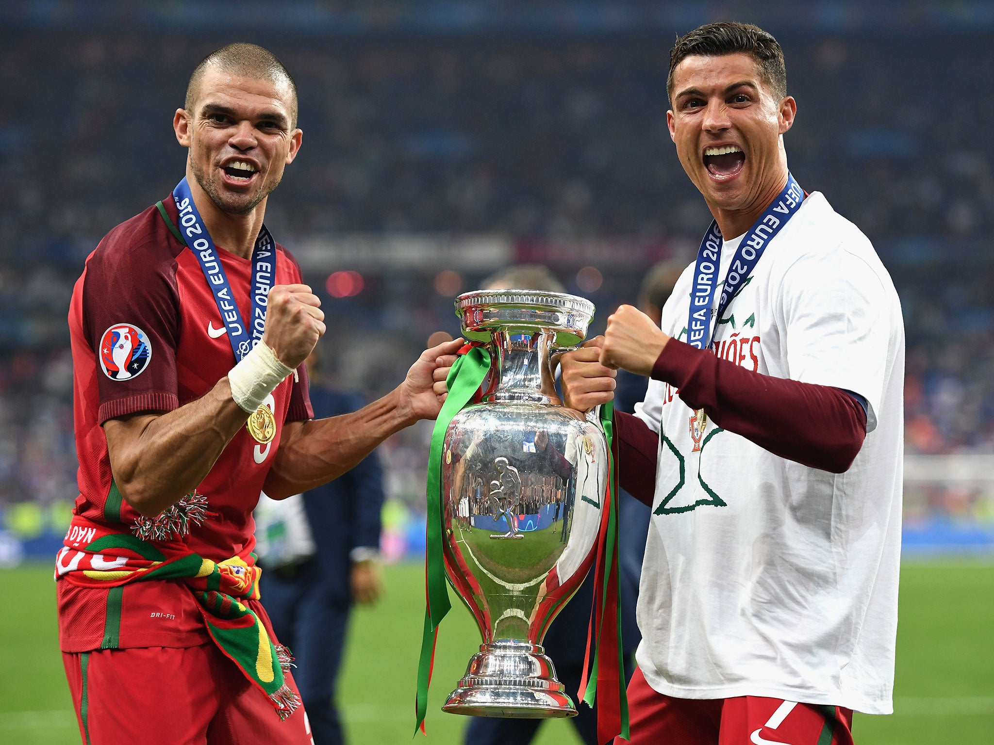 Pepe and Ronaldo with the Henri Delaunay Trophy