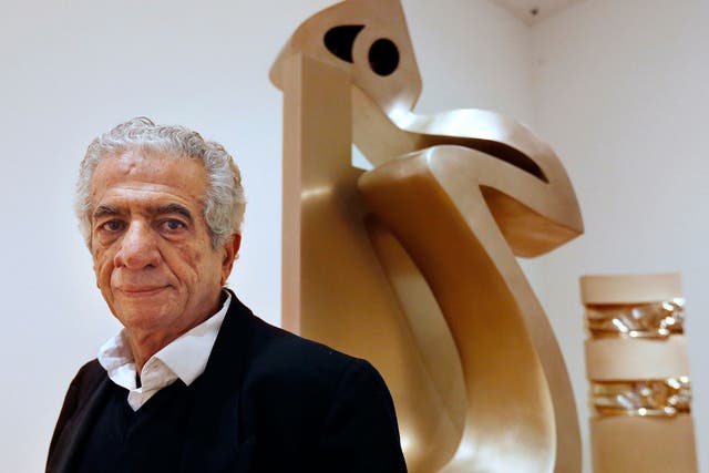 Parviz Tanavoli stands near one of his sculptures called "Heech on Chair" at the Davis Museum on the campus of Wellesley College, US