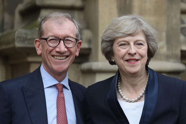 Theresa May with her husband Philip John May outside the Houses of Parliament before she makes a statement after Andrea Leadsom pulled out of the contest