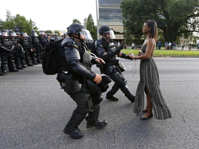 Black Lives Matter protester Ieshia Evans is detained by law enforcement near the headquarters of the Baton Rouge Police Department