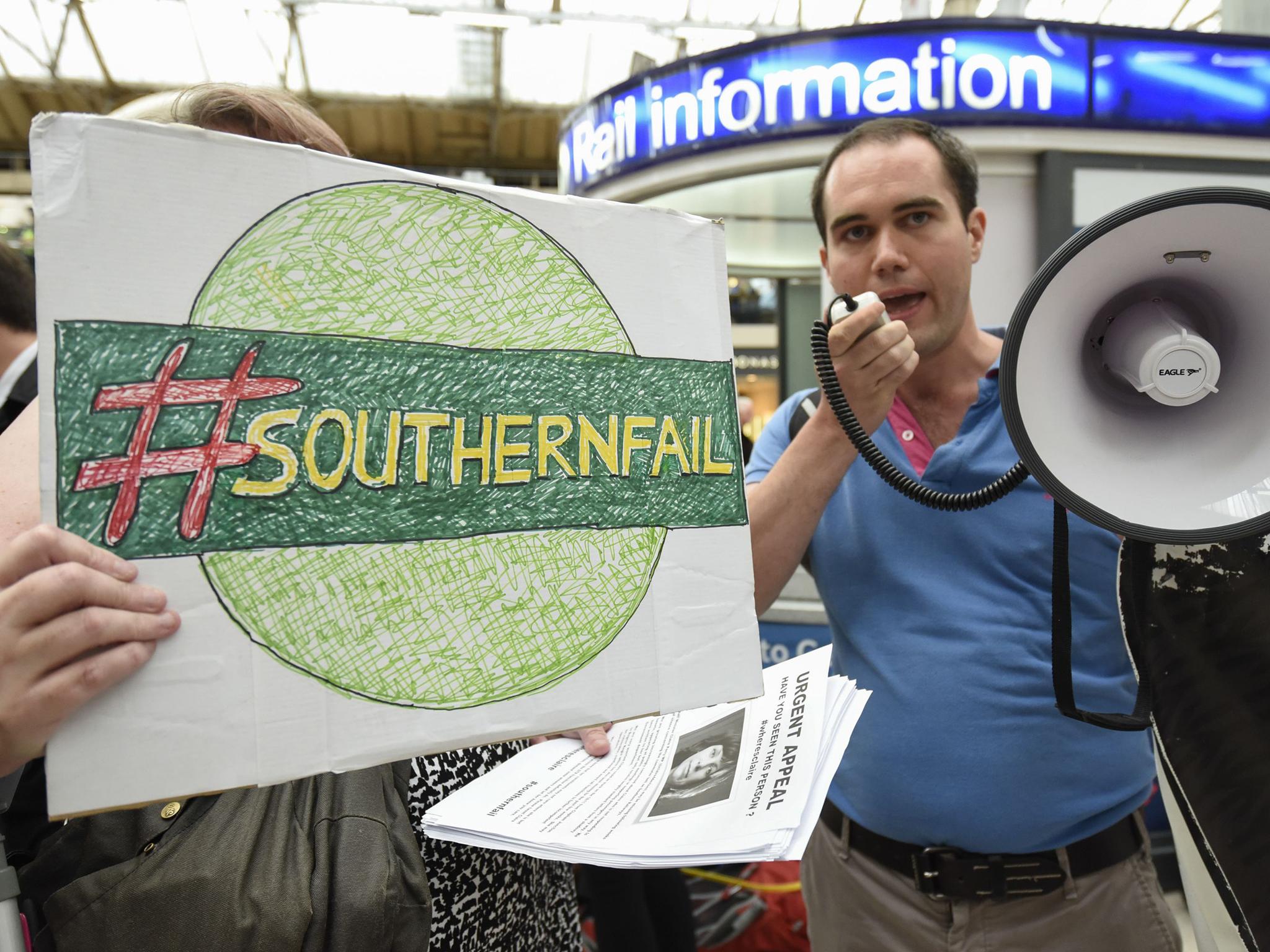 Passengers stage a 'fare strike' and protest at Victoria Station in central London over the performance of Southern Rail