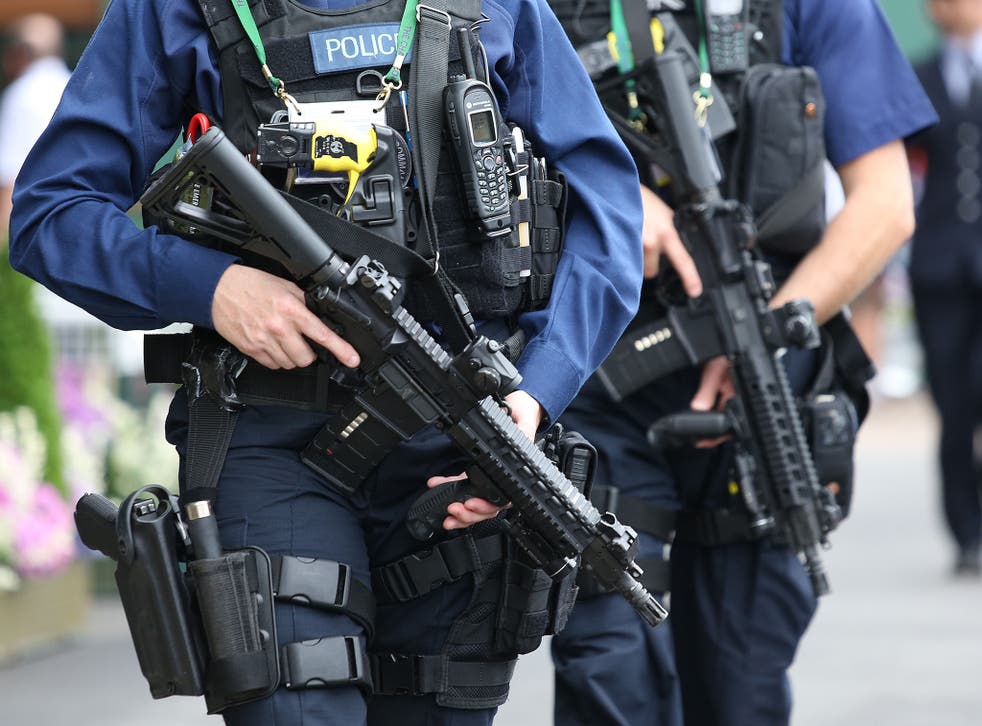 Armed police on patrol near centre court on day five of the Wimbledon Championships