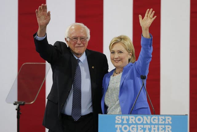 Democratic Presidential candidate Hillary Clinton with former Democratic Presidential candidate Bernie Sanders
