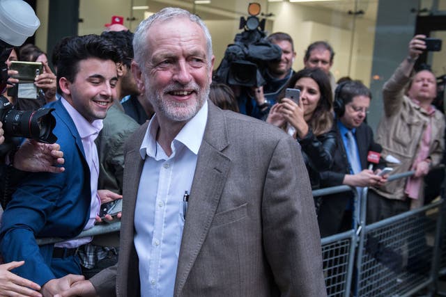 Jeremy Corbyn smiles as he meets supporters and members of the media after attending a meeting of Labour's National Executive Committee in London on July 12, 2016