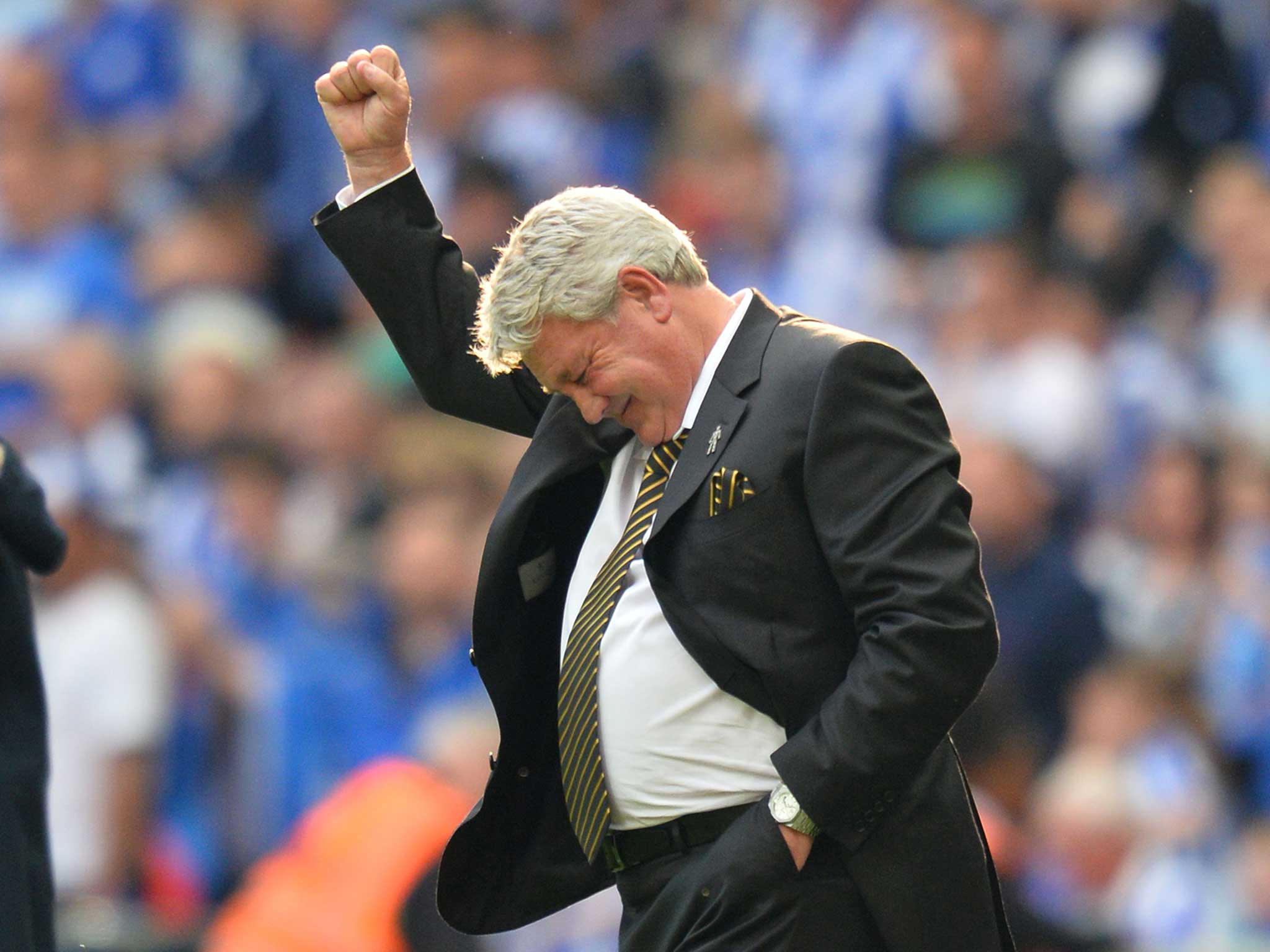 Steve Bruce celebrates guiding Hull City back to the Premier League at Wembley