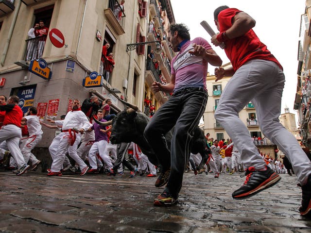 Around 1,000 people took part in the 850m run through Pamplona’s old town