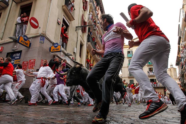 Around 1,000 people took part in the 850m run through Pamplona’s old town