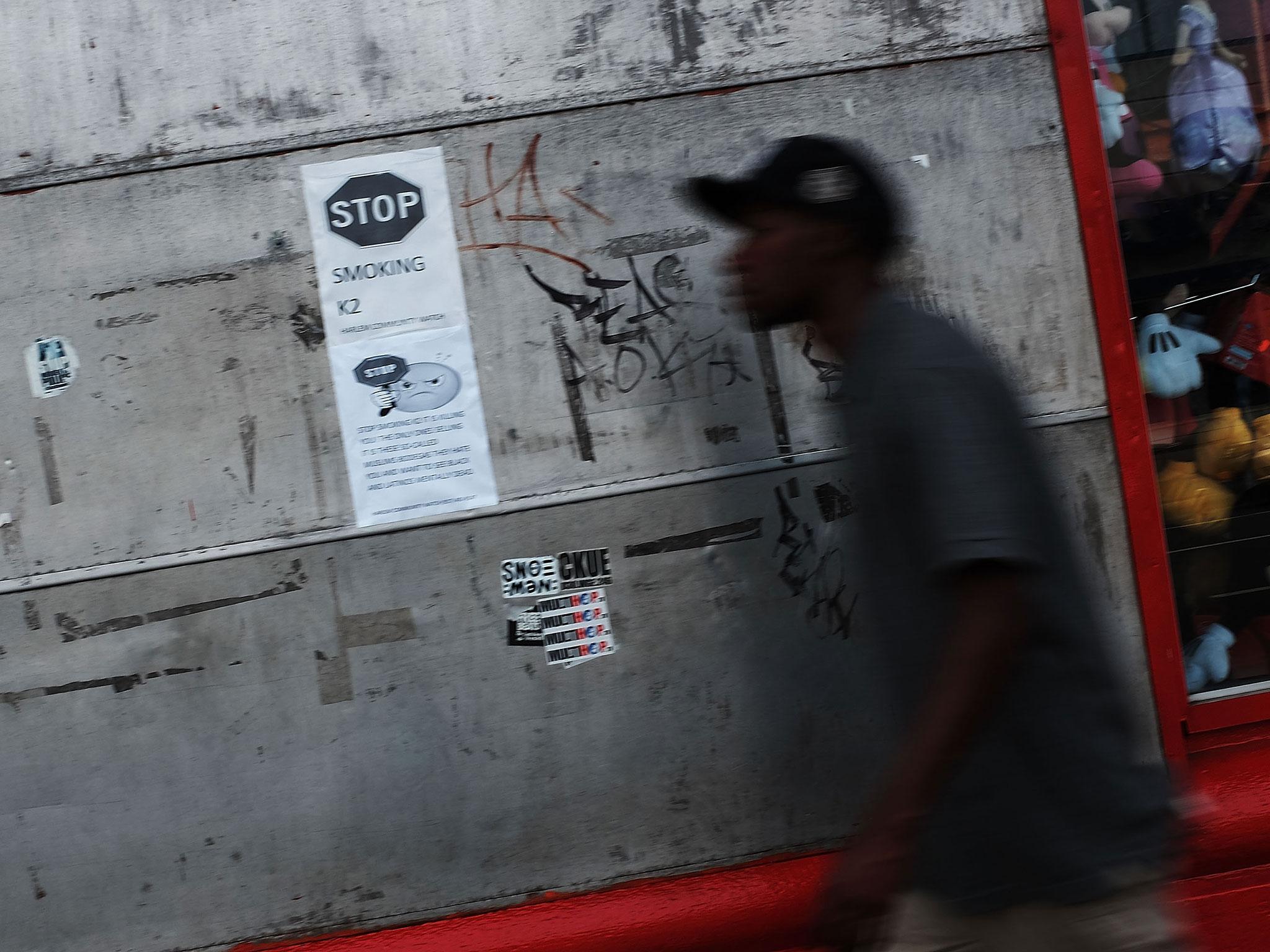 A flier hangs on a wall in an area which has witnessed an explosion in the use of K2, a synthetic marijuana drug, urging people not to smoke the drug in East Harlem