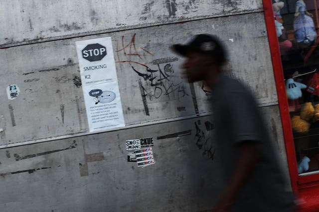 A flier hangs on a wall in an area which has witnessed an explosion in the use of K2, a synthetic marijuana drug, urging people not to smoke the drug in East Harlem