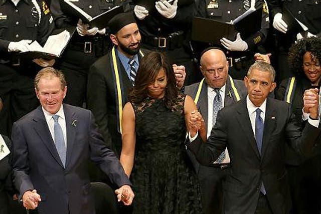 Mr Bush appears to be dancing during the memorial