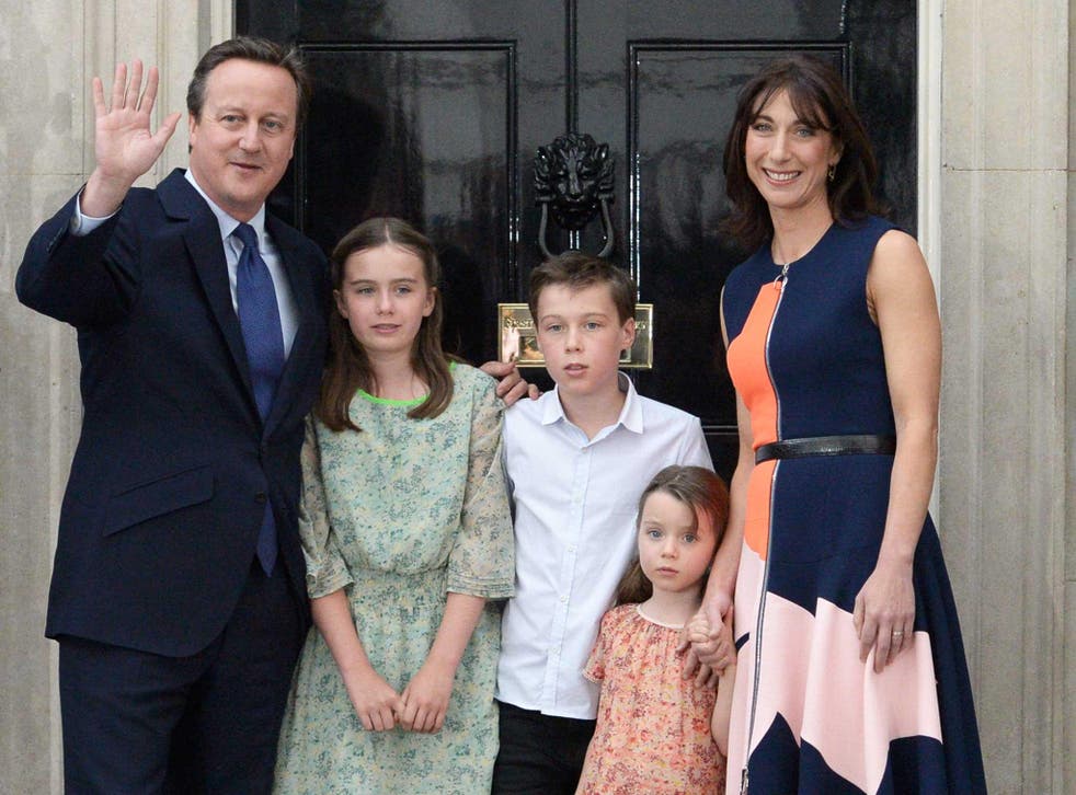 David Cameron waves outside 10 Downing Street with his family as he leaves Downing Street