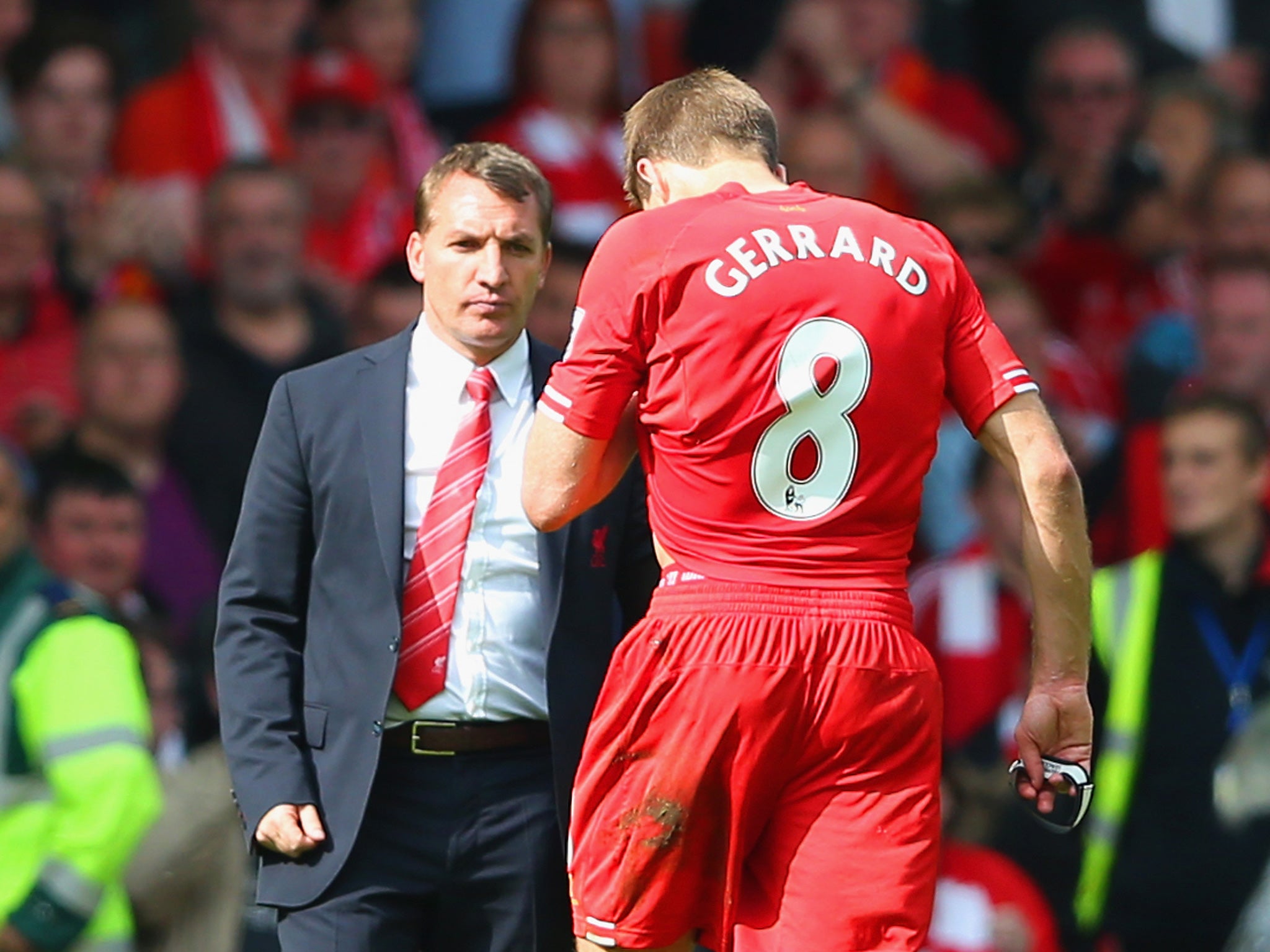 Brendan Rodgers goes to commiserate with Steven Gerrard after defeat to Chelsea in 2014