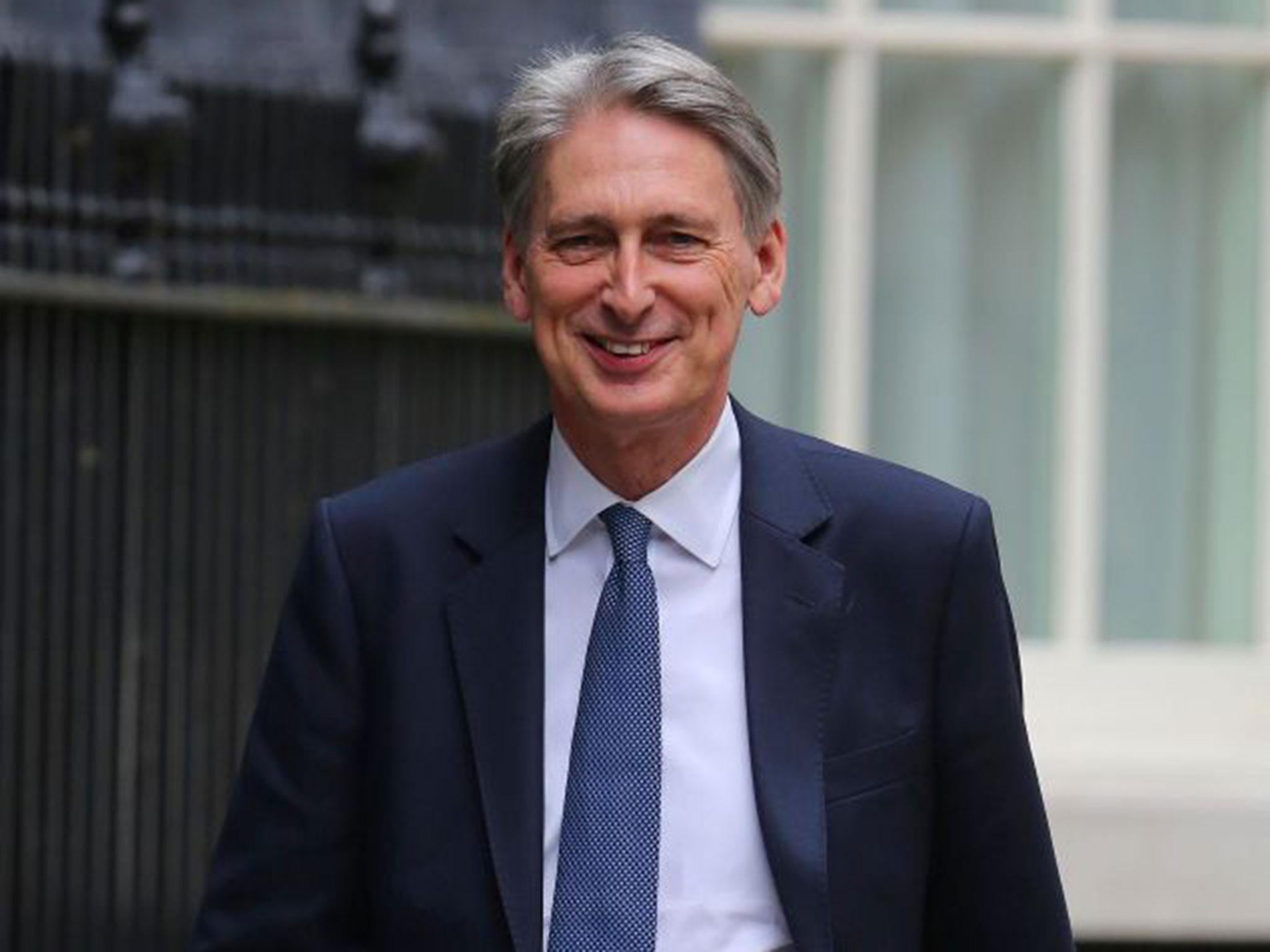 Philip Hammond arrives at Downing Street, shortly before being assigned his new position as Chancellor