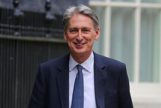 Philip Hammond arrives at Downing Street, shortly before being assigned his new position as Chancellor