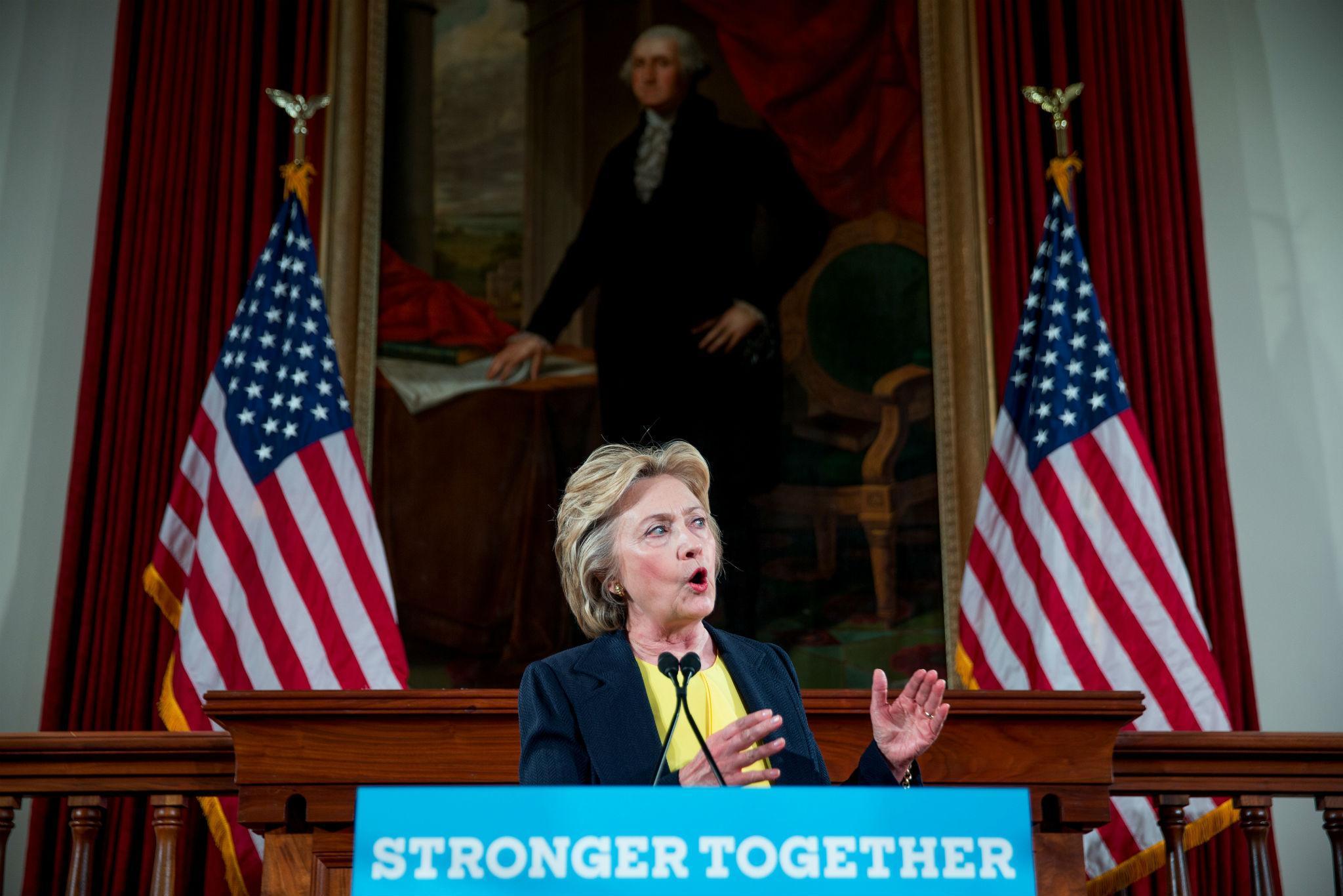 Hillary Clinton speaks beneath a portrait of George Washington at the Illinois Old State House in Springfield