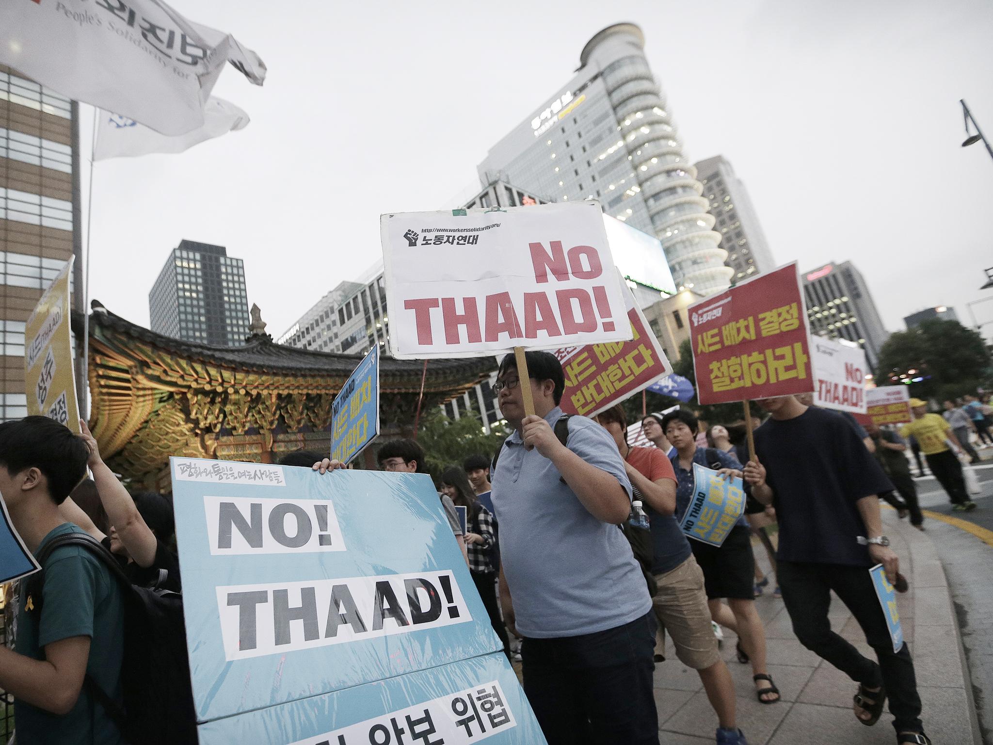 Protesters previously marched toward the US embassy against deploying the THAAD in Seoul, South Korea