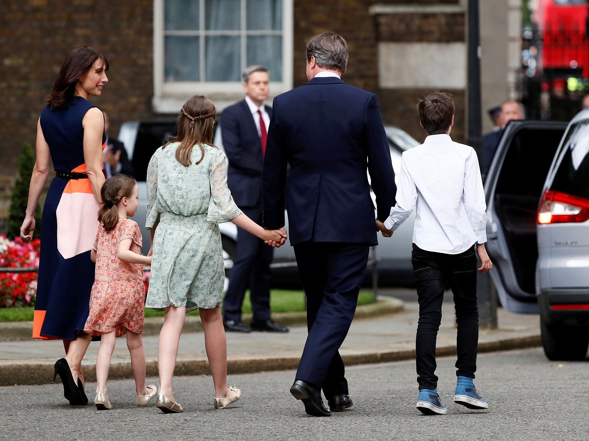 Britain's outgoing Prime Minister, David Cameron, accompanied by his wife Samantha, daughters Nancy (C) and Florence and son Arthur, leaves number 10 Downing Street, on his last day in office