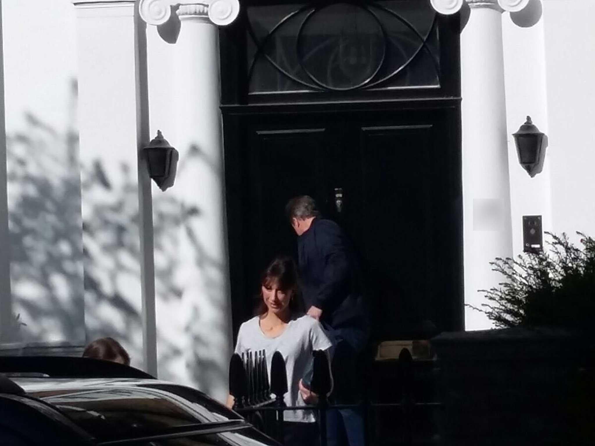 David and Samantha Cameron arrive at their stop-gap home in Holland Park