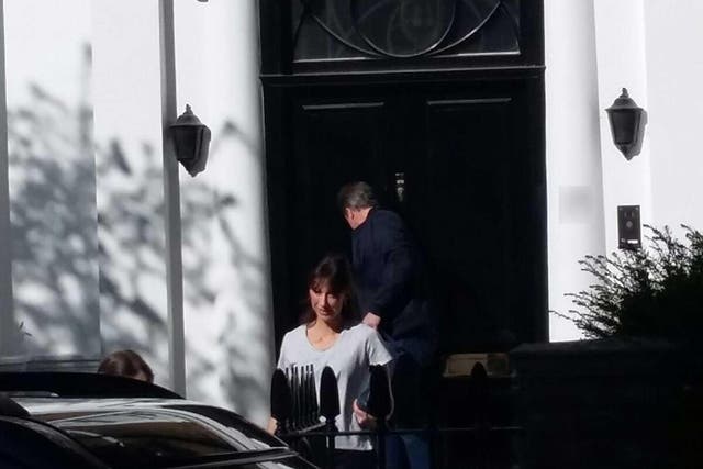 David and Samantha Cameron arrive at their stop-gap home in Holland Park