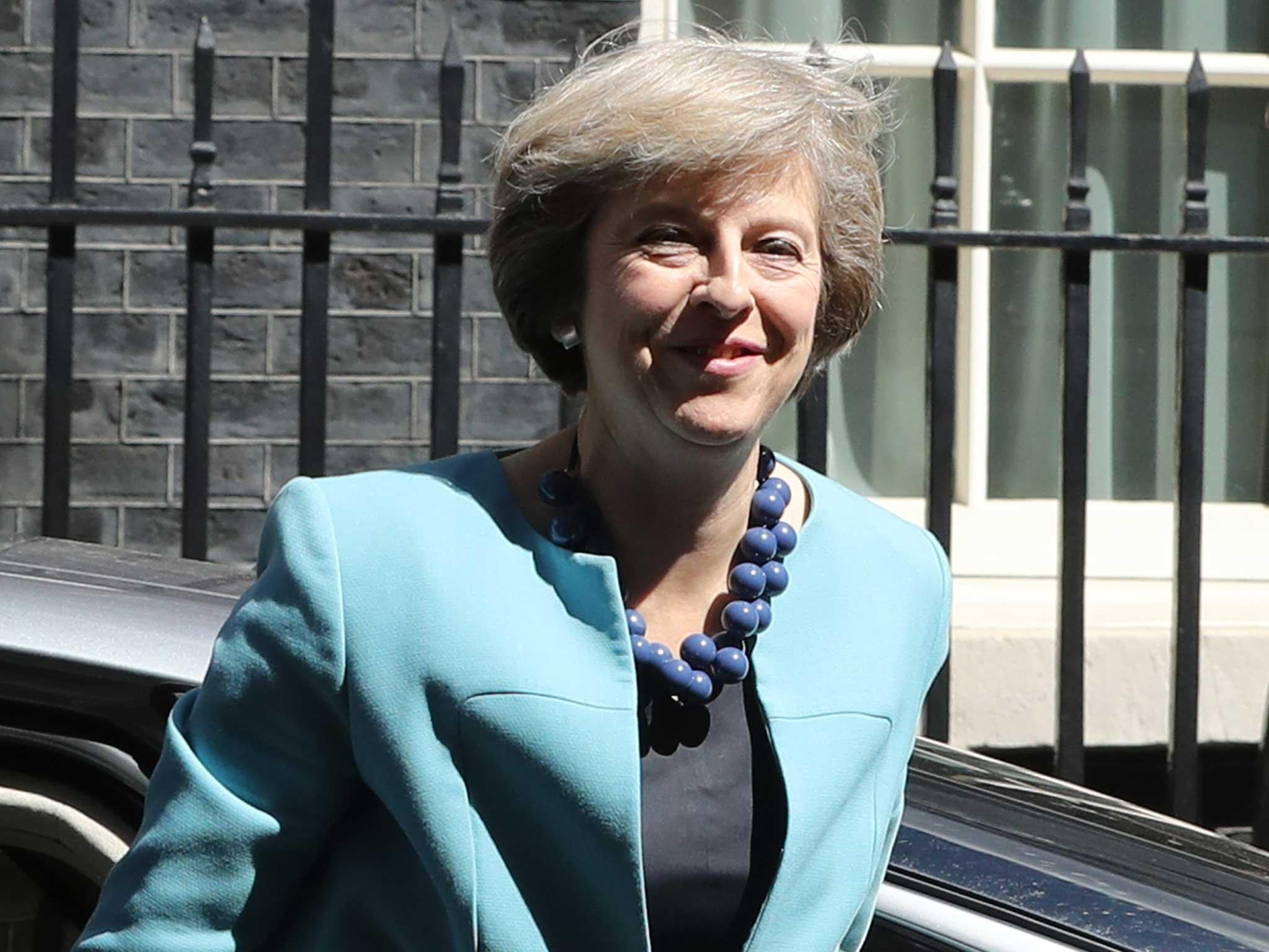 British Prime Minister Theresa May arrives at 10 Downing Street to appoint her cabinet