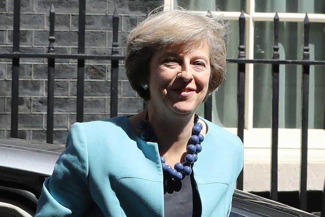 British Prime Minister Theresa May arrives at 10 Downing Street to appoint her cabinet