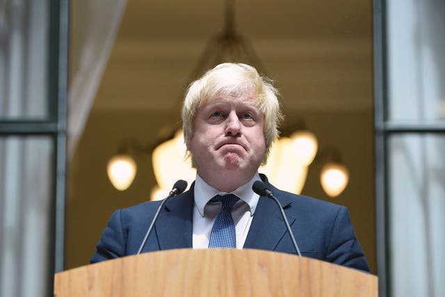 Boris Johnson addresses staff inside the Foreign Office