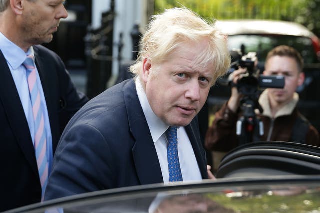 Foreign Secretary Boris Johnson leaves his home in London yesterday morning