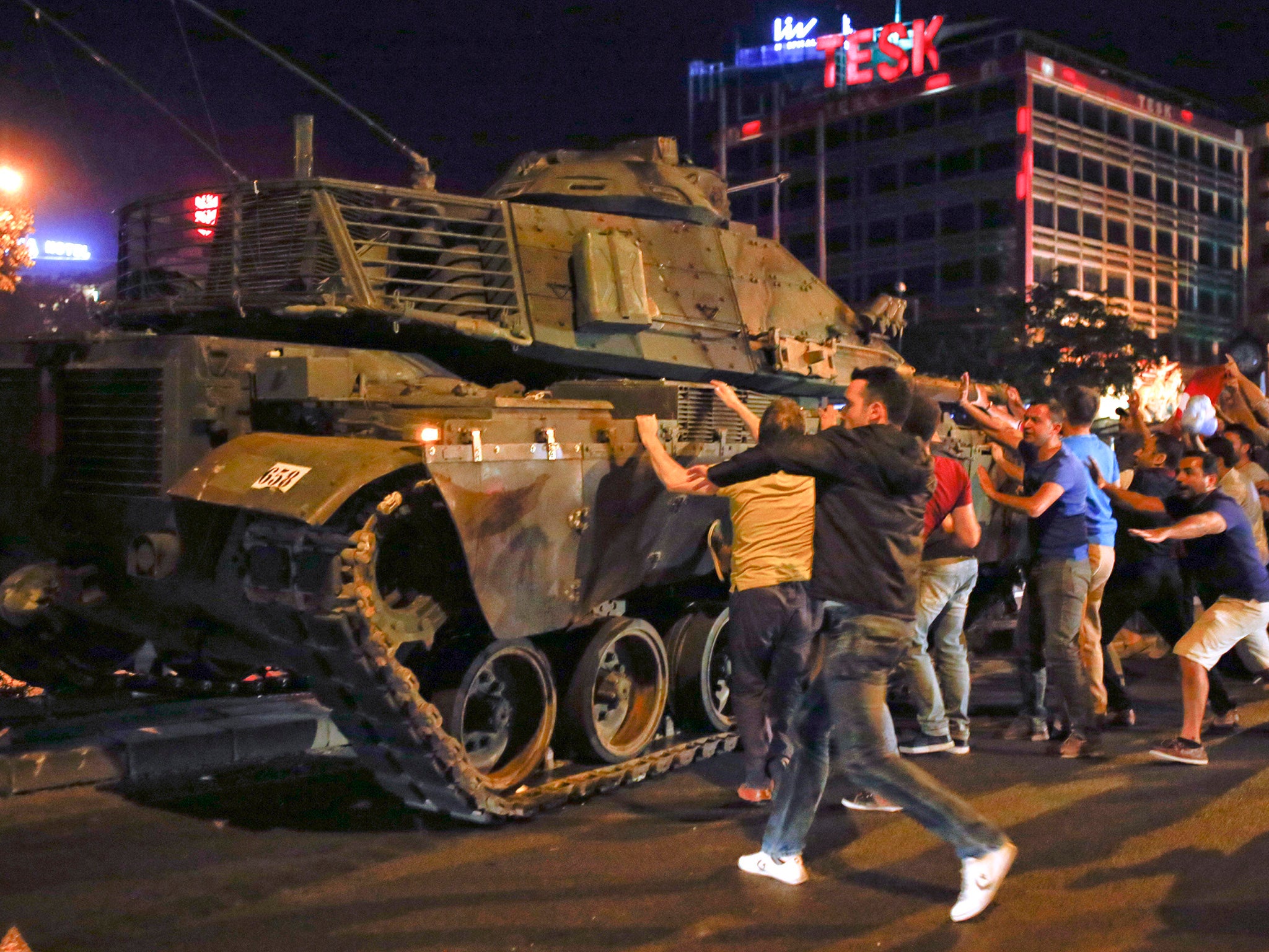 Demonstrators take to the streets as tanks roll through Ankara