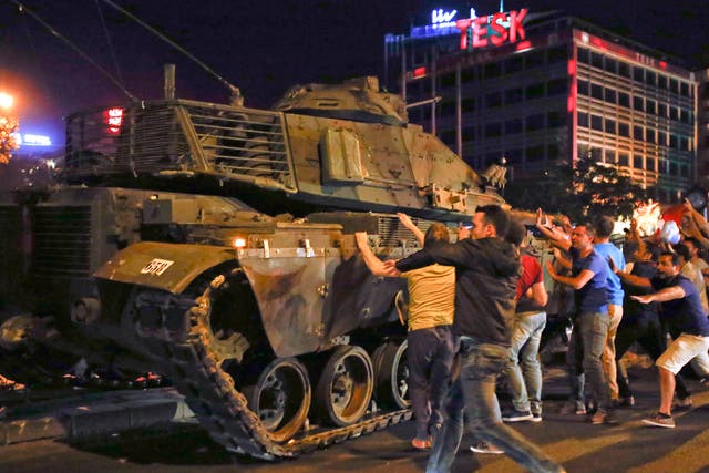Demonstrators take to the streets as tanks roll through Ankara
